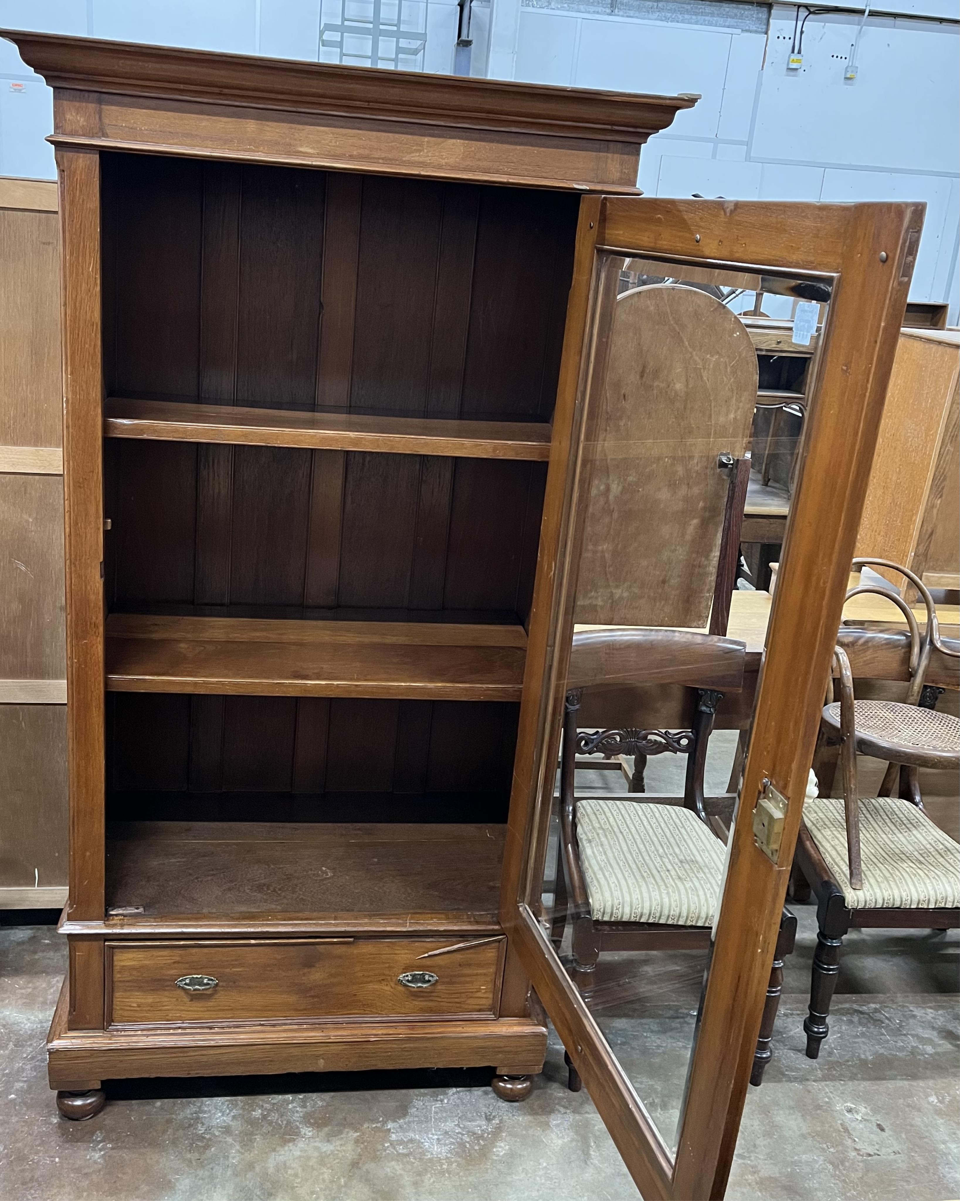 An early 20th century Victorian style Anglo Indian teak bookcase, width 104cm, depth 56cm, height 198cm. Condition - good